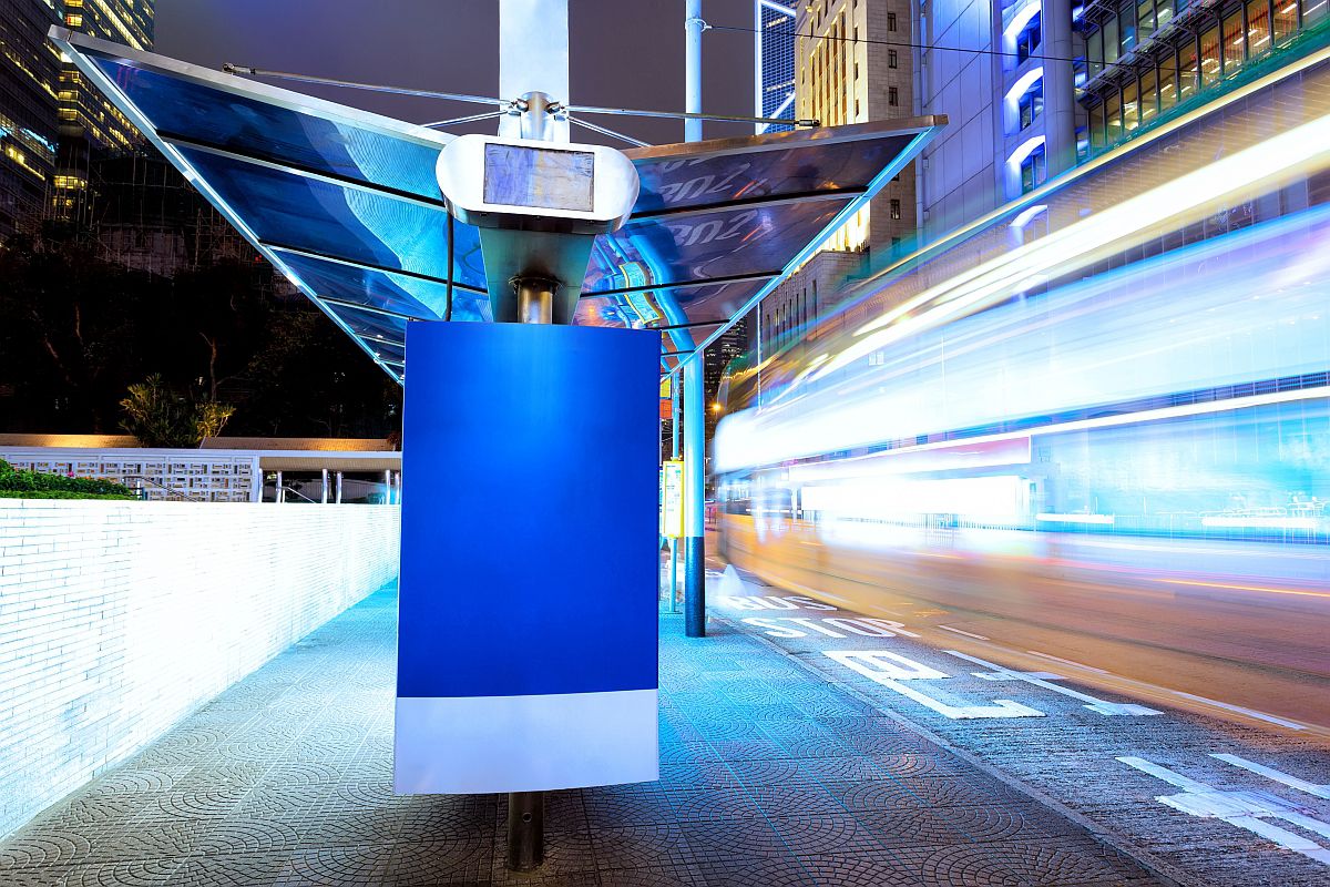 traffic light trails nearby bus stop